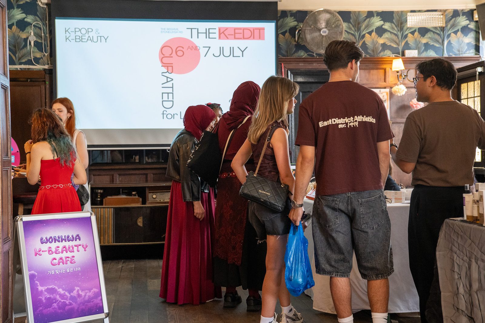 Attendees gathered in front of the event screen during the K-pop programme.