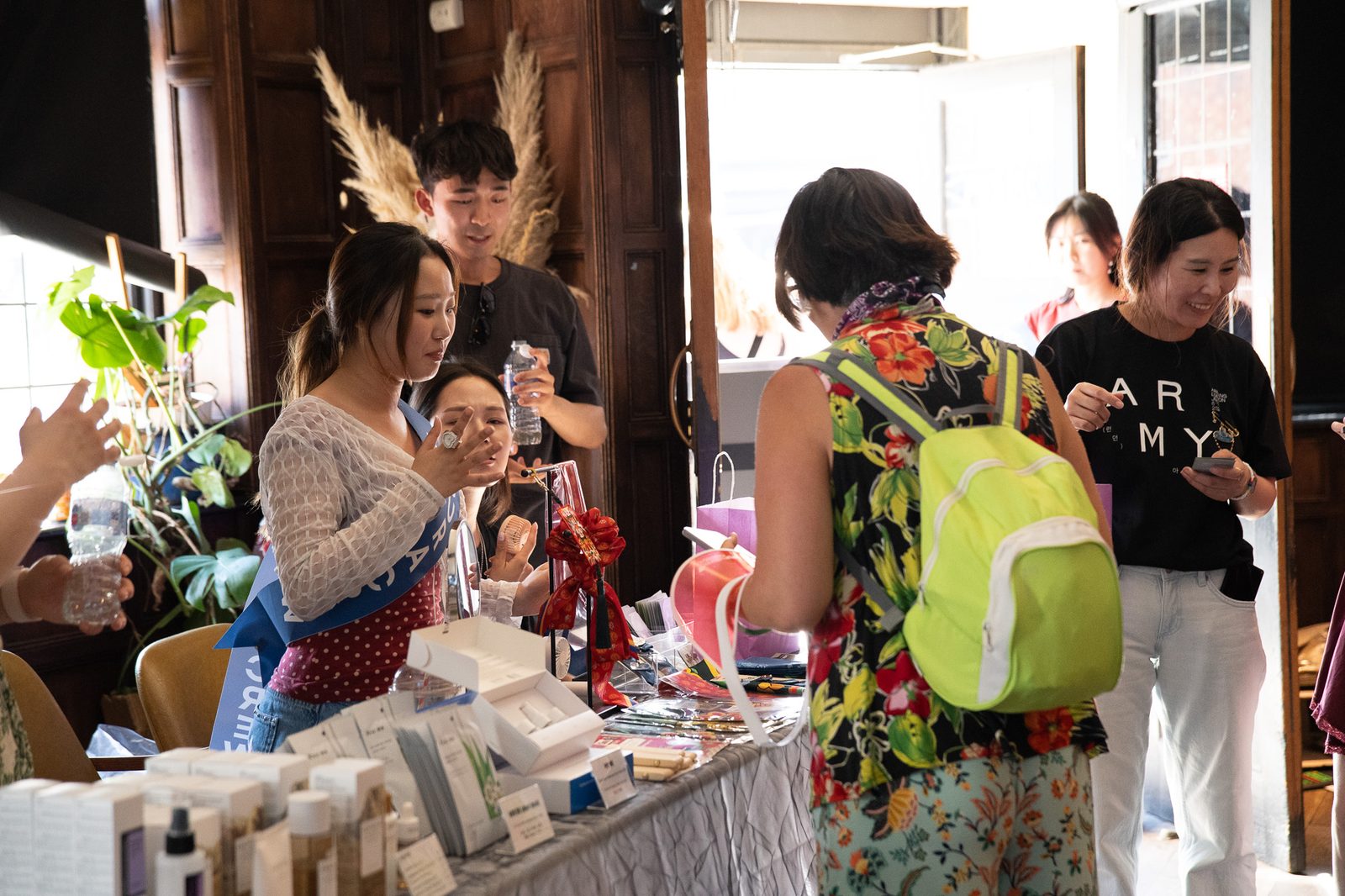 A sampling counter laid out with K-Beauty products as visitors browse.